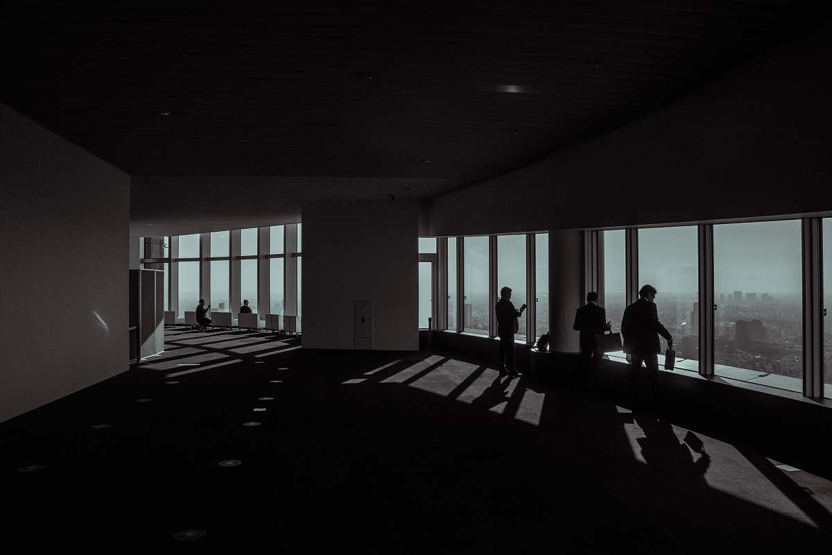 roppongi hills three people standing beside glass window minato